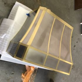 Concave Stainless-Steel and Brass Strappings Range Hood