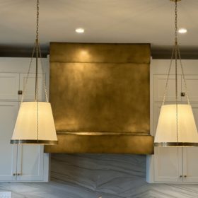 Monolithic-style Aged Brass Range Hood